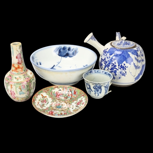 153 - A group of Chinese porcelain, including a large blue and white teapot with side-pouring handle, heig... 