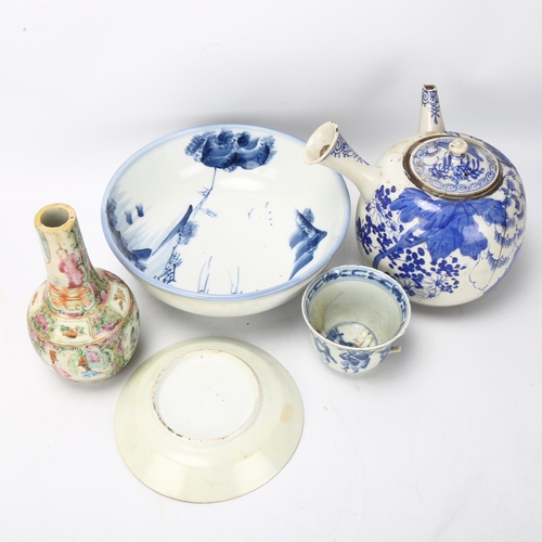 153 - A group of Chinese porcelain, including a large blue and white teapot with side-pouring handle, heig... 