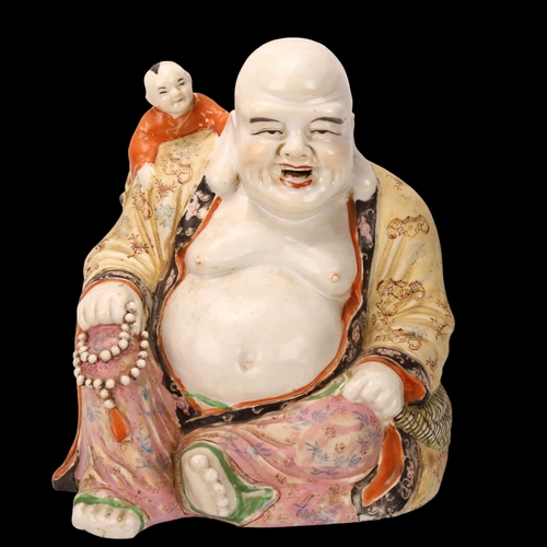 154 - A Chinese porcelain Buddha with child on his shoulders, height 26cm