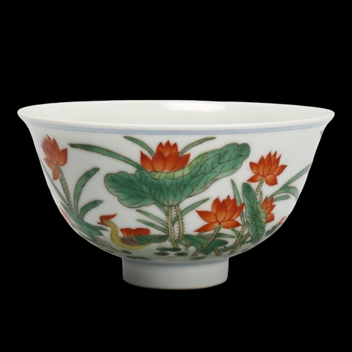 160 - A Chinese porcelain bowl with painted duck and lily flower designs, Qianlong seal mark under, diamet... 