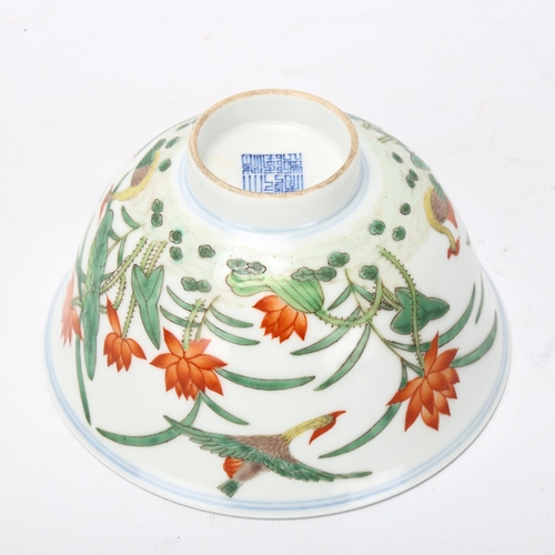 160 - A Chinese porcelain bowl with painted duck and lily flower designs, Qianlong seal mark under, diamet... 