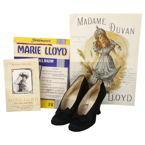 165 - Marie Loyd's silk shoes, together with a signed page from an autograph album dated 1910, certificate... 