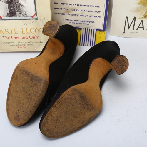 165 - Marie Loyd's silk shoes, together with a signed page from an autograph album dated 1910, certificate... 