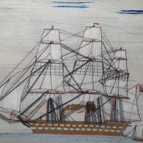 166 - A 19th century sailor's woolwork picture depicting a 3-masted ship at full sail, maple frame, overal... 