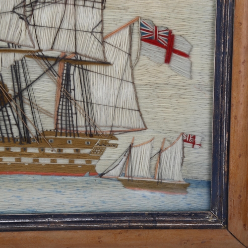 166 - A 19th century sailor's woolwork picture depicting a 3-masted ship at full sail, maple frame, overal... 