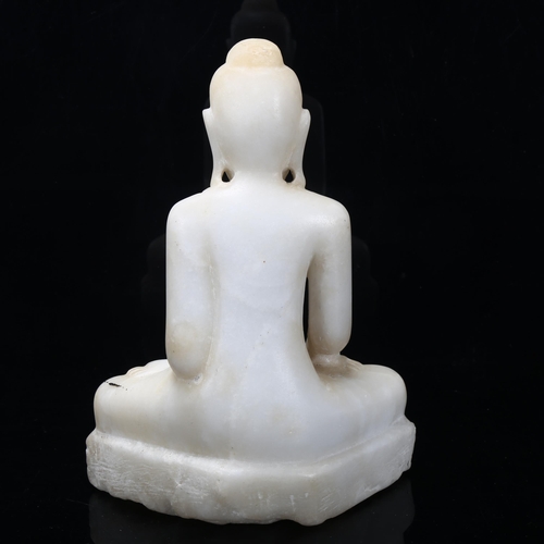 173 - A Chinese carved alabaster seated Buddha, height 25cm