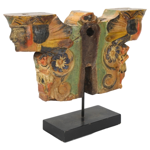 178 - A carved and painted wood architectural moulding, with mask decoration, height 26cm, width 35cm