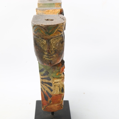 178 - A carved and painted wood architectural moulding, with mask decoration, height 26cm, width 35cm