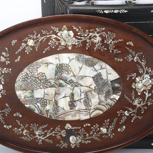 180 - A Chinese mother-of-pearl inlaid ebonised wall panel, 43 x 56cm, and another mother-of-pearl inlaid ... 