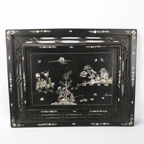 180 - A Chinese mother-of-pearl inlaid ebonised wall panel, 43 x 56cm, and another mother-of-pearl inlaid ... 