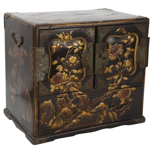 201 - A small Japanese Meiji Period lacquer table cabinet, with gilded butterfly decorated top, shaped rel... 