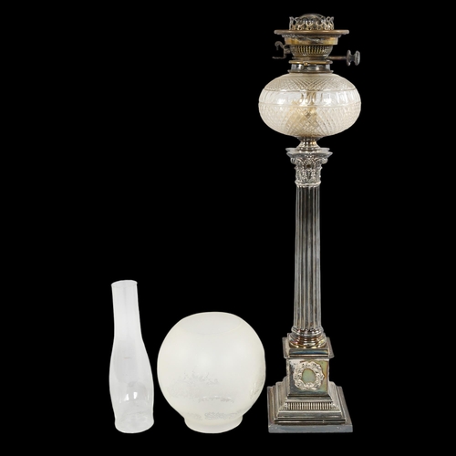 208 - A late 19th century silver plated Corinthian column oil lamp with cut-glass well, with later shade a... 