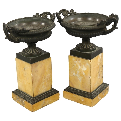 213 - A pair of 19th century bronze tazza urns on Sienna marble plinths, height 23.5cm