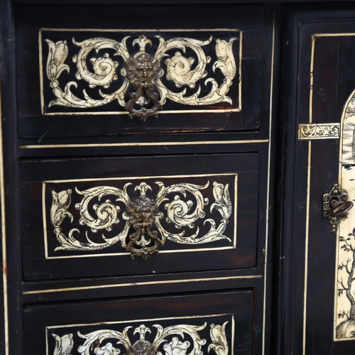 215 - An 18th century Italian ebonised table-top cabinet with ivory engraved panels of Classical form, wit... 