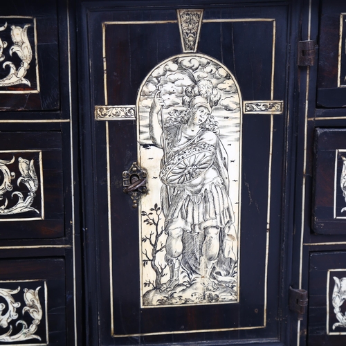 215 - An 18th century Italian ebonised table-top cabinet with ivory engraved panels of Classical form, wit... 