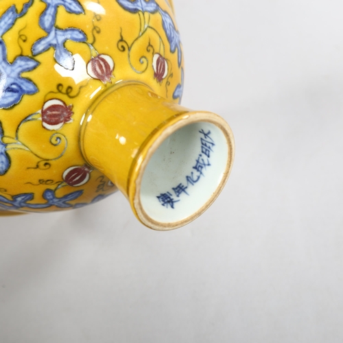 220 - A yellow Chinese stem bowl with blue under-glaze decoration, character marks inside base, height 10.... 