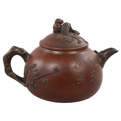 223 - A Chinese Yixing teapot with monkey knop, character marks to base and sides, height 12cm