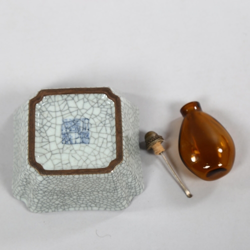 226 - A small Chinese square section crackle glaze dish, character marks to base of dish, and amber glass ... 