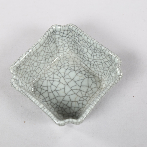 226 - A small Chinese square section crackle glaze dish, character marks to base of dish, and amber glass ... 