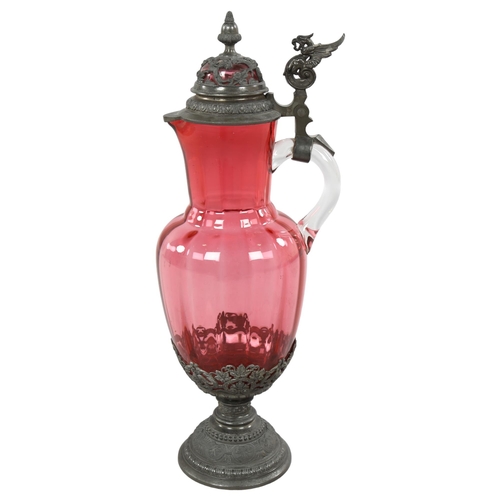 230 - A 19th century German cranberry glass jug with metal mounts, height 14cm