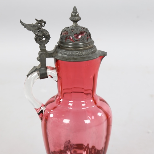 230 - A 19th century German cranberry glass jug with metal mounts, height 14cm