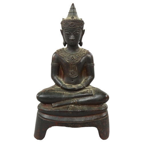 231 - A South East Asian bronze seated Buddha, height 30cm