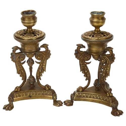 29 - A pair of 19th century Empire style brass candlesticks, with phoenix supports and lion paw feet, hei... 