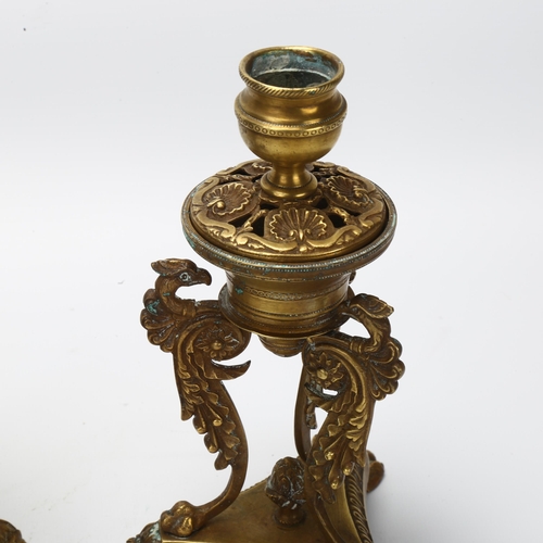 29 - A pair of 19th century Empire style brass candlesticks, with phoenix supports and lion paw feet, hei... 