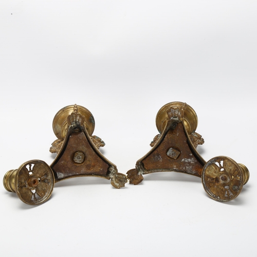 29 - A pair of 19th century Empire style brass candlesticks, with phoenix supports and lion paw feet, hei... 