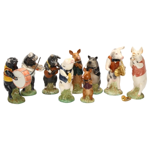 42 - BESWICK - 9-piece pig band, largest height 13cm