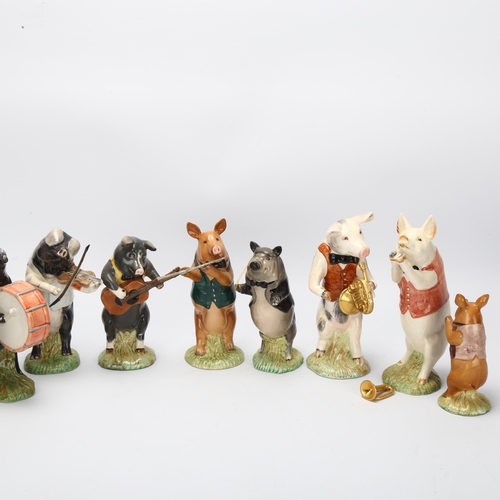 42 - BESWICK - 9-piece pig band, largest height 13cm