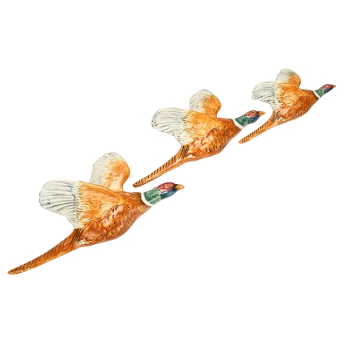 51 - Graduated set of 3 Beswick flying pheasant wall ornaments, pattern no. 661, largest length 31cm