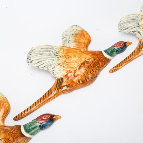 51 - Graduated set of 3 Beswick flying pheasant wall ornaments, pattern no. 661, largest length 31cm