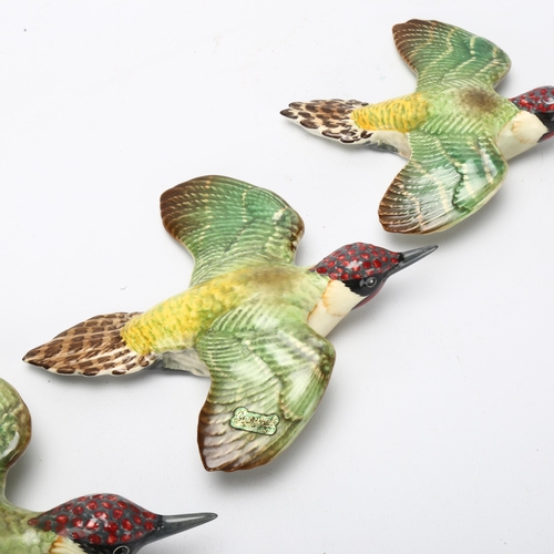 53 - Graduated set of 3 Beswick green woodpecker wall ornaments, pattern no. 1344, largest length 19cm