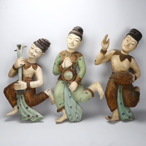 56 - A group of 5 Indian carved and painted wood wall-hanging musician figures, early to mid-20th century... 