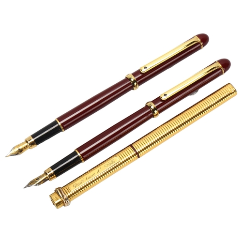 61 - A pair of Morritz burgundy cased fountain pens, and a Cartier gold plated ballpoint pen (3)