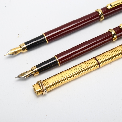 61 - A pair of Morritz burgundy cased fountain pens, and a Cartier gold plated ballpoint pen (3)