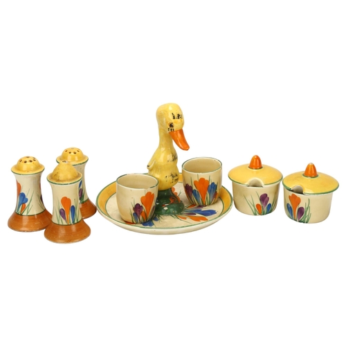 62 - A group of Clarice Cliff Crocus pattern items, including a novelty stand with duckling handle, regis... 