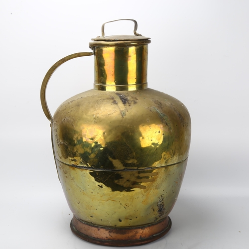 69 - A large Dutch copper and brass flagon and cover, height 58cm