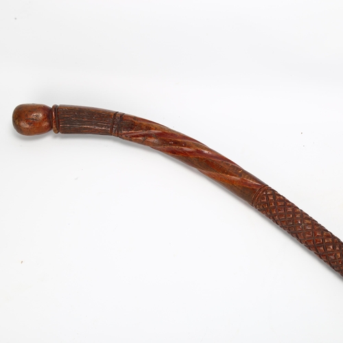 87 - A Fiji carved hardwood war club, with chip carved handle and twist decorated stem, length approx 89c... 