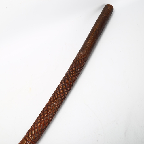 87 - A Fiji carved hardwood war club, with chip carved handle and twist decorated stem, length approx 89c... 