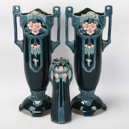 93 - Eichwald Pottery, pair of tall blue glaze 2-handled vases with relief moulded flowers, height 34cm, ... 