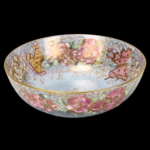 94 - Royal Doulton lustre glaze pottery bowl, with floral surround decorated by M D McWilliam, diameter 2... 