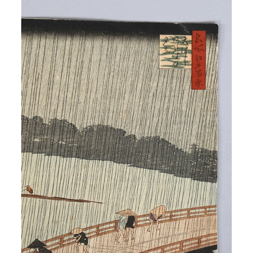 575 - Ando Hiroshige, sudden shower over Shin Ohashi bridge, woodblock print published after 1857, 27cm x ... 