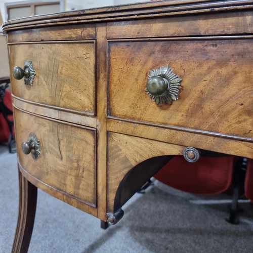 131 - A Regency mahogany bow-front kneehole sideboard of small size, with 5 frieze drawers, original brass... 