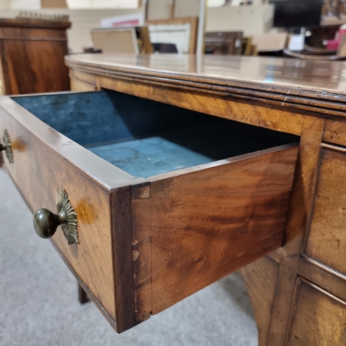 131 - A Regency mahogany bow-front kneehole sideboard of small size, with 5 frieze drawers, original brass... 