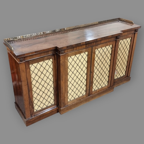 134 - A Regency rosewood break-front 4-door side cabinet, with cast-brass gallery, brass lattice panelled ... 