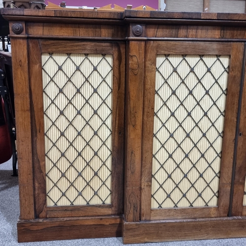 134 - A Regency rosewood break-front 4-door side cabinet, with cast-brass gallery, brass lattice panelled ... 