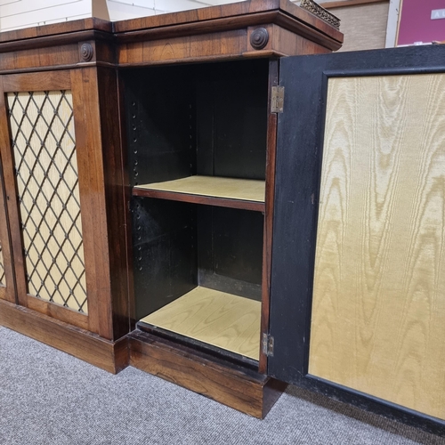 134 - A Regency rosewood break-front 4-door side cabinet, with cast-brass gallery, brass lattice panelled ... 