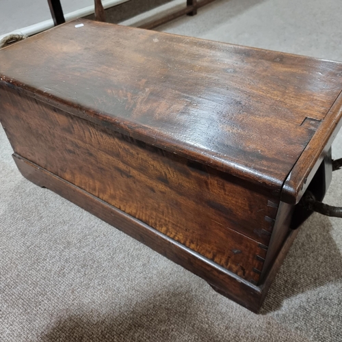 74 - **DESCRIPTION CHANGE** A 19th century camphor wood sea chest, with rope handles, length 87cm